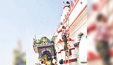 Members of the VSSUT team inspect the temple on Monday 