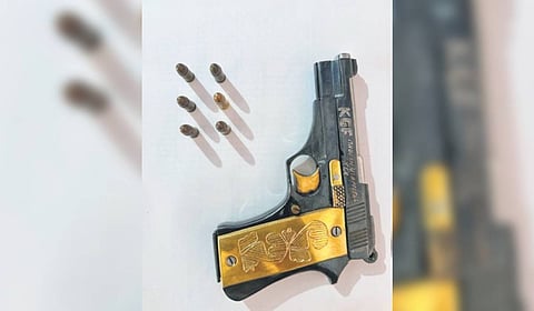 The seized country-made pistol with ‘KGF’ engraved on it.