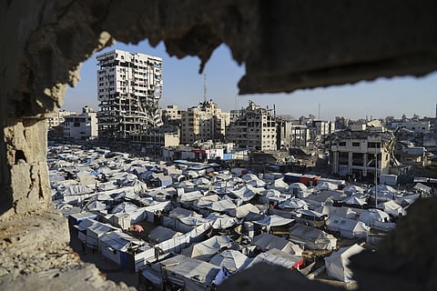 A makeshift tent camp for displaced Palestinians stretches across Gaza City 