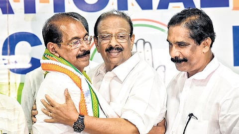 KPCC president K Sudhakaran congratulating his successor-elect Sunny Joseph at a press meet at the Kannur DCC office on Thursday