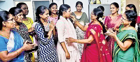  V Keerthika being congratulated by her teachers at Girls’ Higher Secondary School in Pulla Avenue, Shenoy Nagar