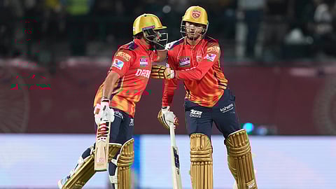 Punjab Kings' Priyansh Arya, right, receives a pat from batting partner Prabhsimran Singh during the Indian Premier League match against Delhi Capitals (Photo | AP)