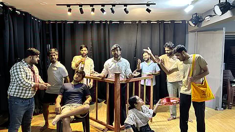 A rehearsal of Deluxe Haircutting Salon, captured