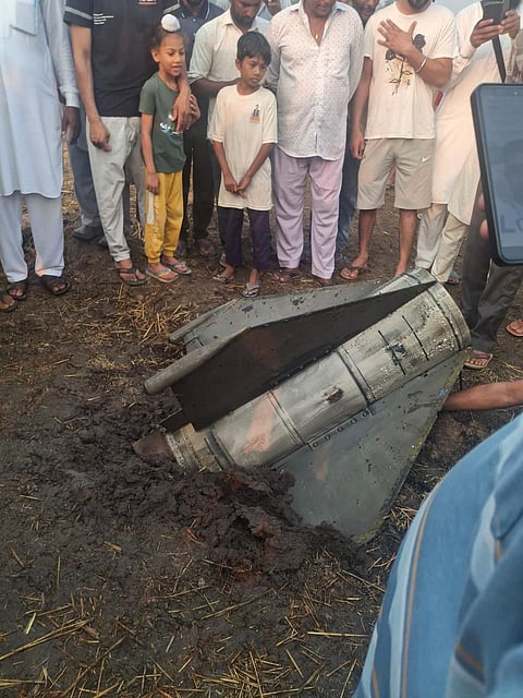 Children gathered to have a look at a missile debris in Punjab.