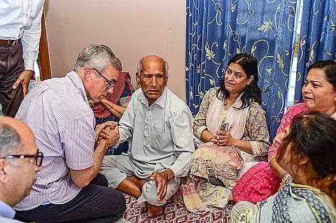 In this image released by @CM_JnK via X on Saturday, May 10, 2025, J&K Chief Minister Omar Abdullah during a condolence meeting with the family members of Raj Kumar Thapa, Additional District Development Commissioner, Rajouri, who succumbed to his injuries after an artillery shell hit his official residence in Rajouri town, J&K. 
