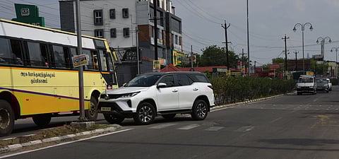 A car driver tries to get to the opposite lane, taking advantage of the lack of safety  barriers on the median on the Chennai NH near Thiruvanaikovil.