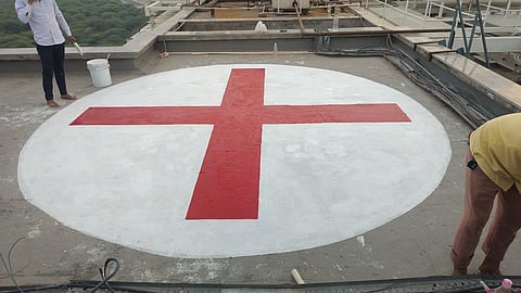 Red Cross om the roof of a hospital in Delhi.