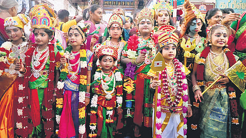 Children dressed as Goddess Meenakshi and Lord Murugan during the Chithirai festival in Madurai