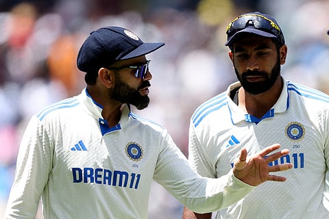 India's Virat Kohli (L) and Jasprit Bumrah.
