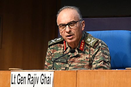 This handout photograph taken on May 1, 2025 and released by the Pakistan's Inter Service Public Relation (ISPR) shows Pakistan's Army Chief General Syed Asim Munir (2L) standS on military tank whicle speaking with army troops.