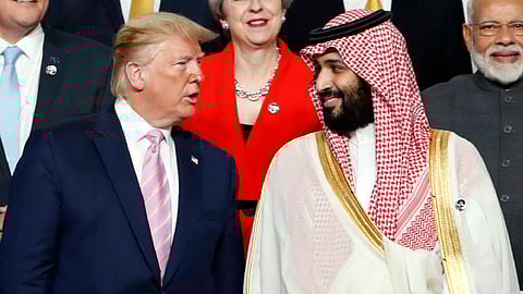 US President Donald Trump, left, speaks with Saudi Arabia's Crown Prince Mohammed bin Salman during a family photo session at the G-20 leaders summit in Osaka, Japan, June 28, 2019.