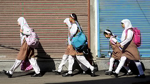 Students head to school as educational institutions reopen in non-border districts  after remaining closed for nearly a week due to India-Pakistan tensions in Srinagar.