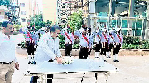 The mortal remains of Swashri Ayan being given guard of honour.