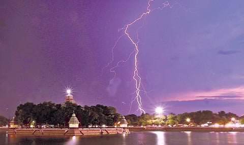 Lightning behind the Teppakulam Mandapam in Madurai on Tuesday.