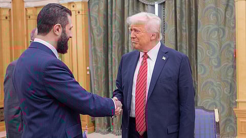 In this photo released by the Saudi Royal Palace, President Donald Trump, right, shakes hands with Syria's interim President Ahmad al-Sharaa, in Riyadh, Saudi Arabia, Wednesday, May 14, 2025.