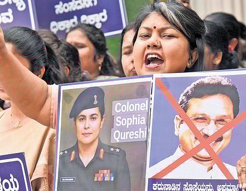 Karnataka Mahila Congress president Sowmya Reddy raises slogans against Madhya Pradesh Tribal Affairs Minister Kunwar Vijay Shah, over his controversial statement on Col Sofiya Qureshi, in Bengaluru.