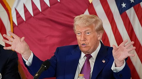 President Donald Trump gestures during a business roundtable, Thursday, May 15, 2025, in Doha, Qatar.