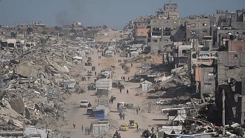 Displaced Palestinians fleeing Beit Lahia amid ongoing Israeli military operations in the Gaza Strip arrive in Jabalia, northern Gaza, on Friday, May 16, 2025. 