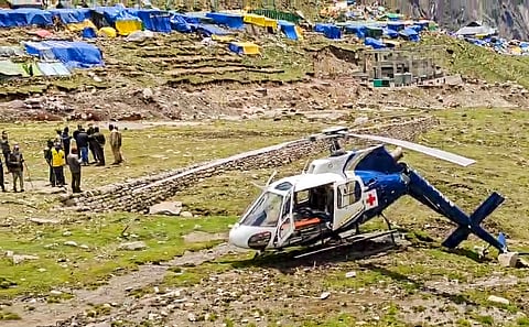 A damaged helicopter of AIIMS Rishikesh's heli ambulance service after it crashed while landing, at Kedarnath.