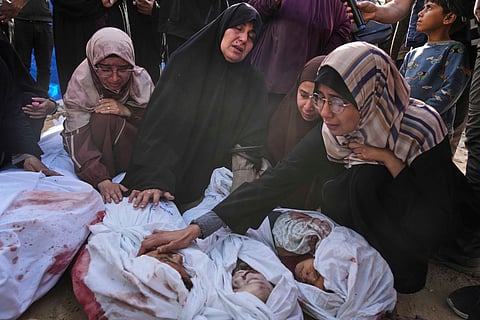 Palestinians mourn children from their families who were killed in Israeli airstrikes in Jabalia, in the northern Gaza Strip, on Wednesday, May 14, 2025. According to local hospitals, the strikes killed 48 people, including 22 children.