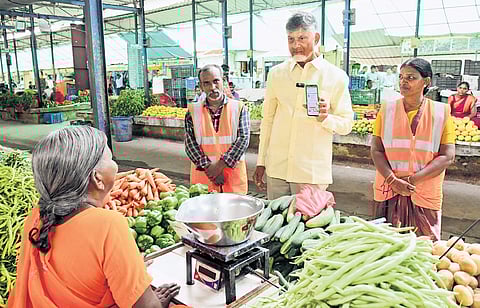 CM Chandrababu Naidu interacts with a vegetable vendor in Kurnool 