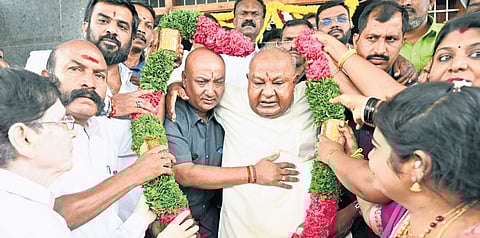 Supporters garlanded former prime minister and JDS supremo HD Deve Gowda on his 92nd birthday at the party office in Bengaluru on Sunday.