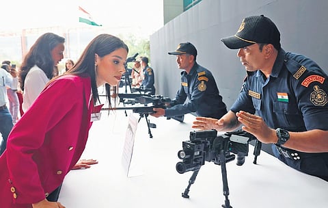 Police personnel demonstrate high-tech weapons to Miss World contestants at the Integrated Command and Control Centre in Hyderabad on Sunday.
