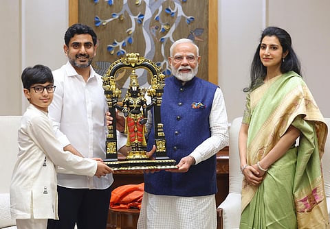 Prime Minister Modi with Minister for HRD, IT and Electronics Nara Lokesh, along with his wife Brahmani and son Devansh
