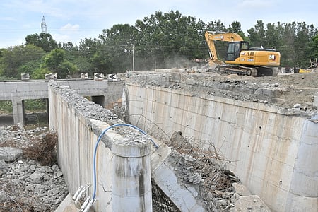 The demolition of the old bridge near Kuniyamuthur is under way