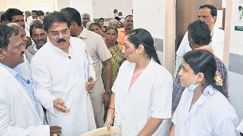 Civil Supplies Minister Nadendla Manohar interacts with health and medical officials at Kolllipara Community Health Center in Tenali on Sunday