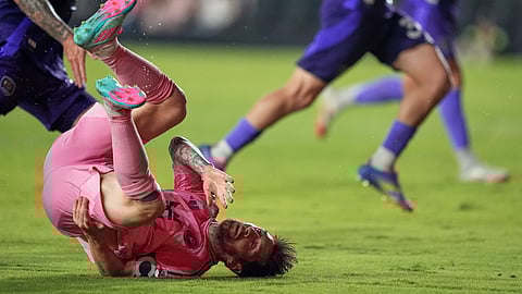 Inter Miami forward Lionel Messi (10) takes a tumble during the second half of an MLS soccer match against Orlando City, Sunday, May 18, 2025, in Fort Lauderdale, Fla.