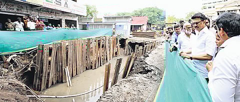 CM M K Stalin inspecting the stormwater drain; (below) CM interacting with the students after opening ladies' hostel at Queen Mary’s College