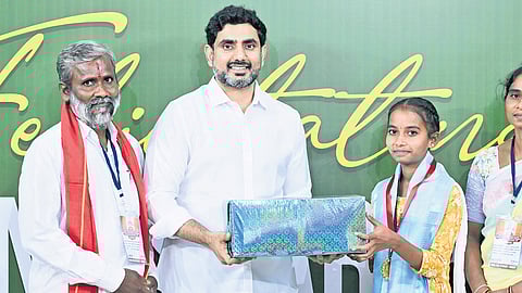 HRD Minister N Lokesh felicitates an SSC topper at the ‘Shining Stars’ event at his Undavalli residence on Tuesday.