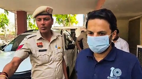 Ashoka University professor Ali Khan Mahmudabad being escorted by police personnel after his arrest, in Sonipat, Haryana on May 18 