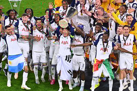 Tottenham's Heung-Min Son raises the trophy of the Europa League after the final soccer match between Tottenham Hotspur and Manchester United at the San Mamés Stadium in Bilbao, Spain, Wednesday, May 21, 2025. 