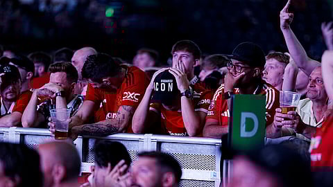 Manchester United fans react during a screening of the Europa League final football match between Manchester United and Tottenham Hotspur taking place in Bilbao, at the AO Arena, Manchester, England, Wednesday, May 21, 2025.