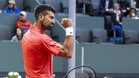 Novak Djokovic, of Serbia, reacts after winning a point against Matteo Arnaldi of Italy during their quarter-final match