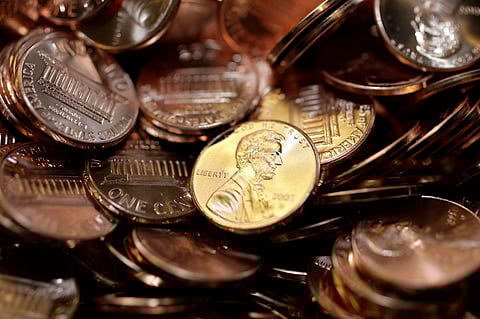 Freshly-made pennies sit in a bin at the U.S. Mint in Denver