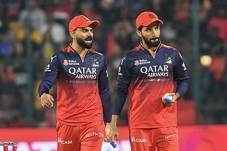 Virat Kohli with RCB skipper Rajat Patidar.