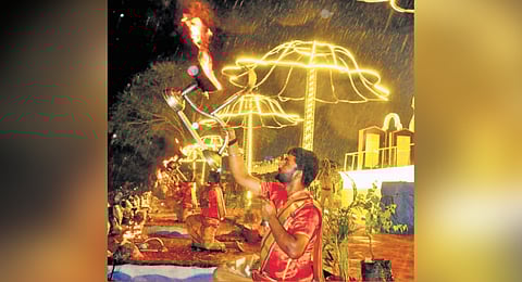 Priests perform harati during ongoing Saraswati Pushkaralu on the banks of the Godavari River at the Kaleshwara Mukteshwara temple in Kaleshwaram