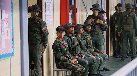 Military personnel line up to vote in legislative and local elections in Caracas, Venezuela, Sunday, May 25, 2025.