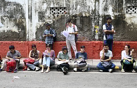 UPSC aspirants outside the UPSC Head office before appearing for the Preliminary exams at Odisha on Sunday, May 25, 2025.