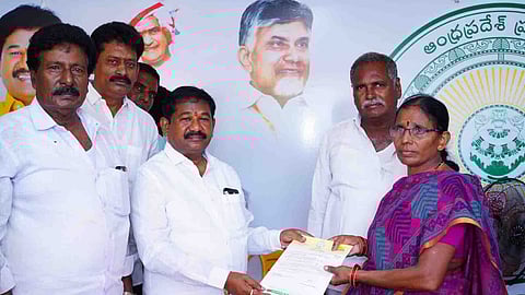 SW Minister Dr Swamy distributes CMRF cheques to the beneficiaries at a program held in his Turpu Naidupalem camp office on Sunday.