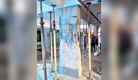 The L-section column of RDS Avenue I tower at Panampilly Nagar that spalled off revealing bent rods.