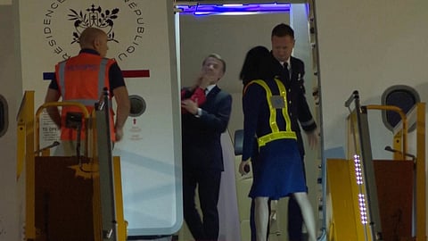 In this grab taken from video, France's President Emmanuel Macron prepares to disembark a plane on arrival, in Hanoi, Vietnam, Sunday, May 25, 2025.