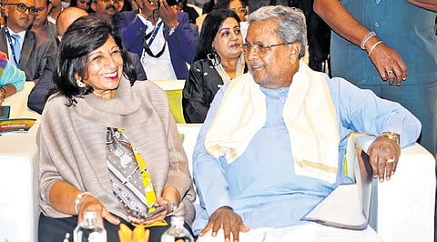 Biocon Chairperson Kiran Mazumdar-Shaw and Chief Minister Siddaramaiah 
share a light moment during an event to announce the University of Liverpool’s  Bengaluru campus on Tuesday 