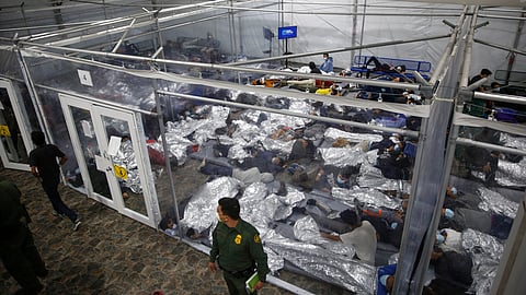 Minors lie inside a pod at the Donna Department of Homeland Security holding facility, the main detention centre for unaccompanied children in the Rio Grande Valley run by US Customs and Border Protection (CBP), in Donna, Texas.