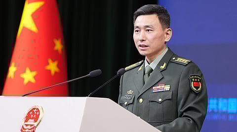 China’s Defense Ministry spokesperson, Senior Colonel Zhang Xiaogang, speaks during a press conference in Beijing.