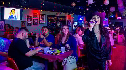 Audrey Campos speaks during a Loteria game night at Jackie O's Cocktail Club in Fort Worth, Texas, Tuesday, May 27, 2025.
