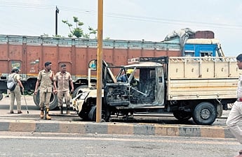 The pickup van torched by agitators at Sarasmal chowk.